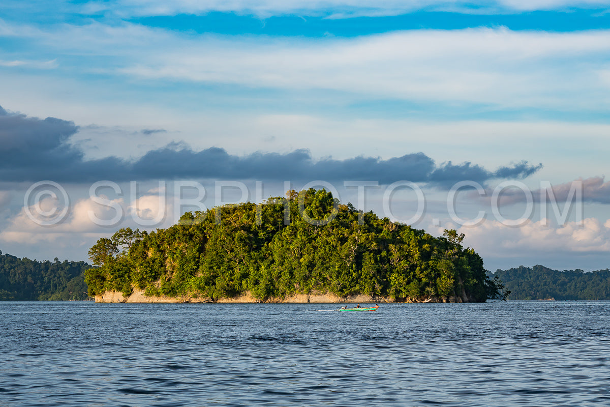 East Misool- group of small island in shallow blue lagoon water at sunset- Raja Ampat- West Papua- Indonesia
