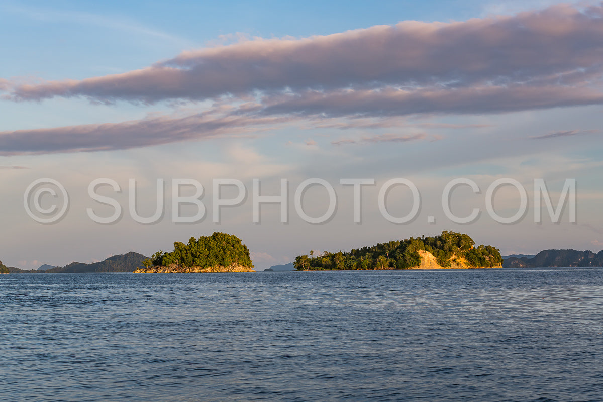 East Misool- group of small island in shallow blue lagoon water at sunset- Raja Ampat- West Papua- Indonesia