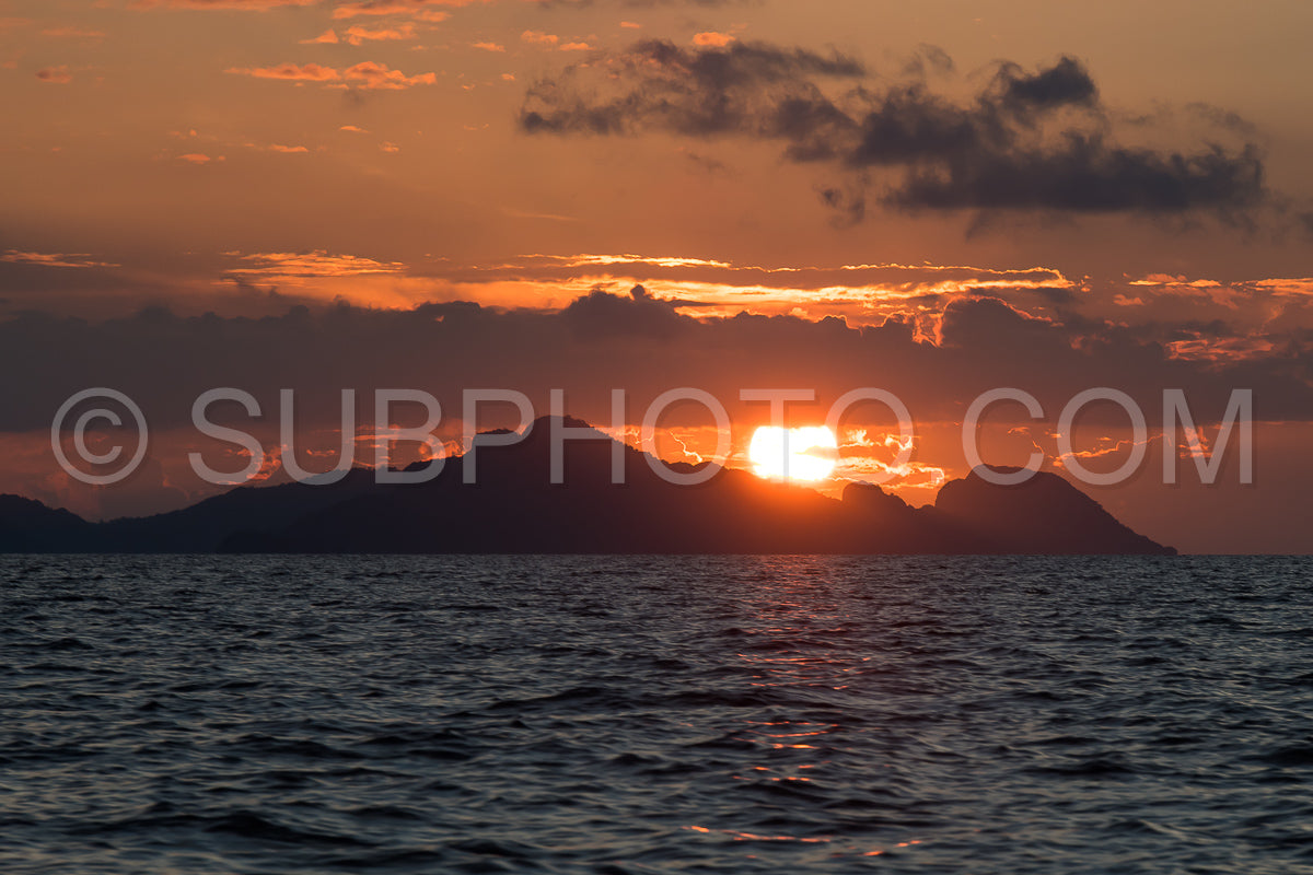 East Misool- group of small island in shallow blue lagoon water at sunset- Raja Ampat- West Papua- Indonesia