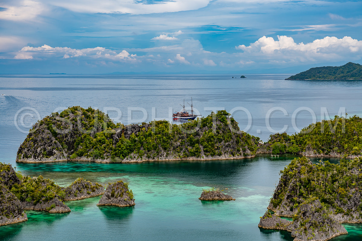 Waigeo- Kri- Mushroom Island- group of small islands in shallow blue lagoon water- Raja Ampat- West Papua- Indonesia