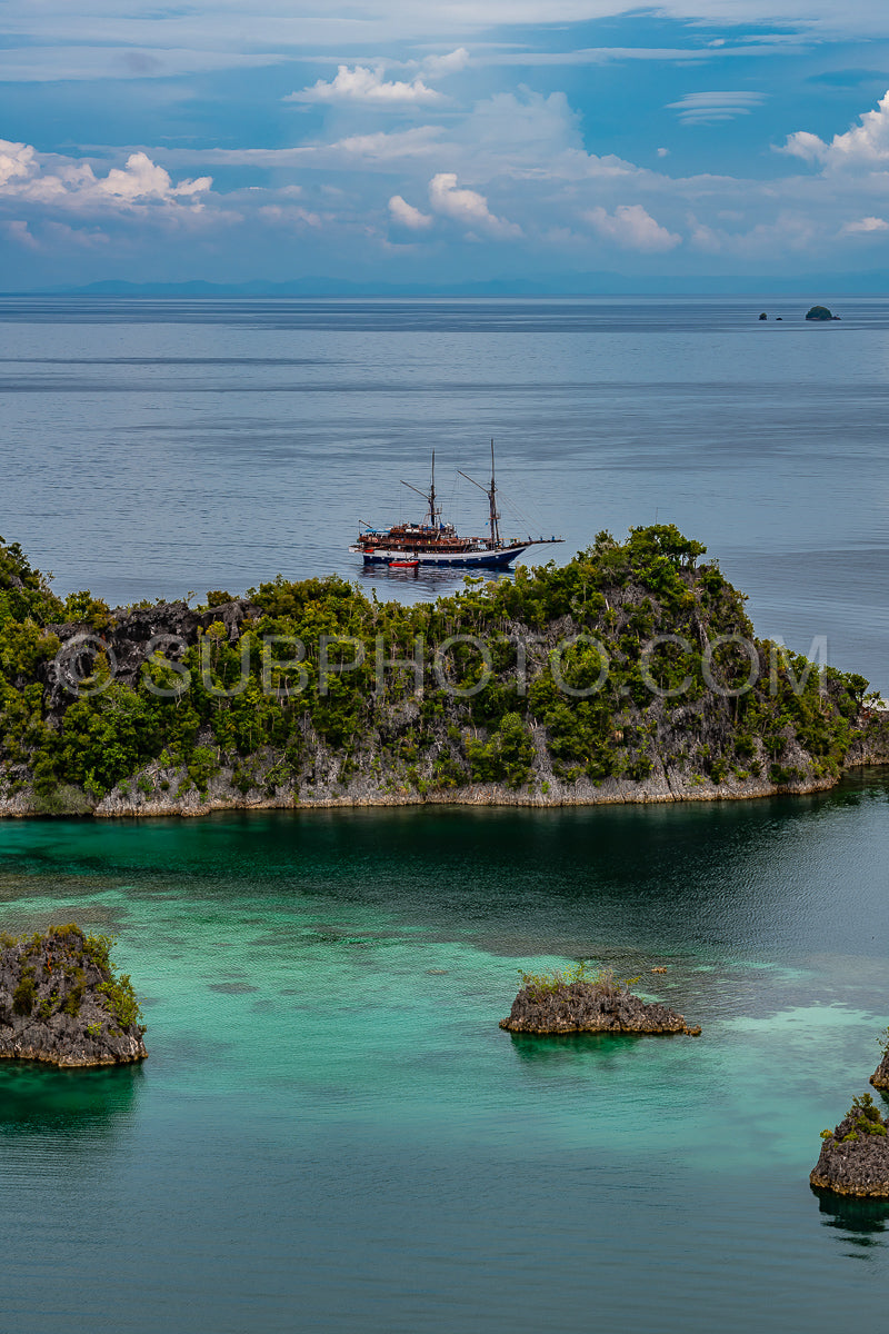 Waigeo- Kri- Mushroom Island- group of small islands in shallow blue lagoon water- Raja Ampat- West Papua- Indonesia