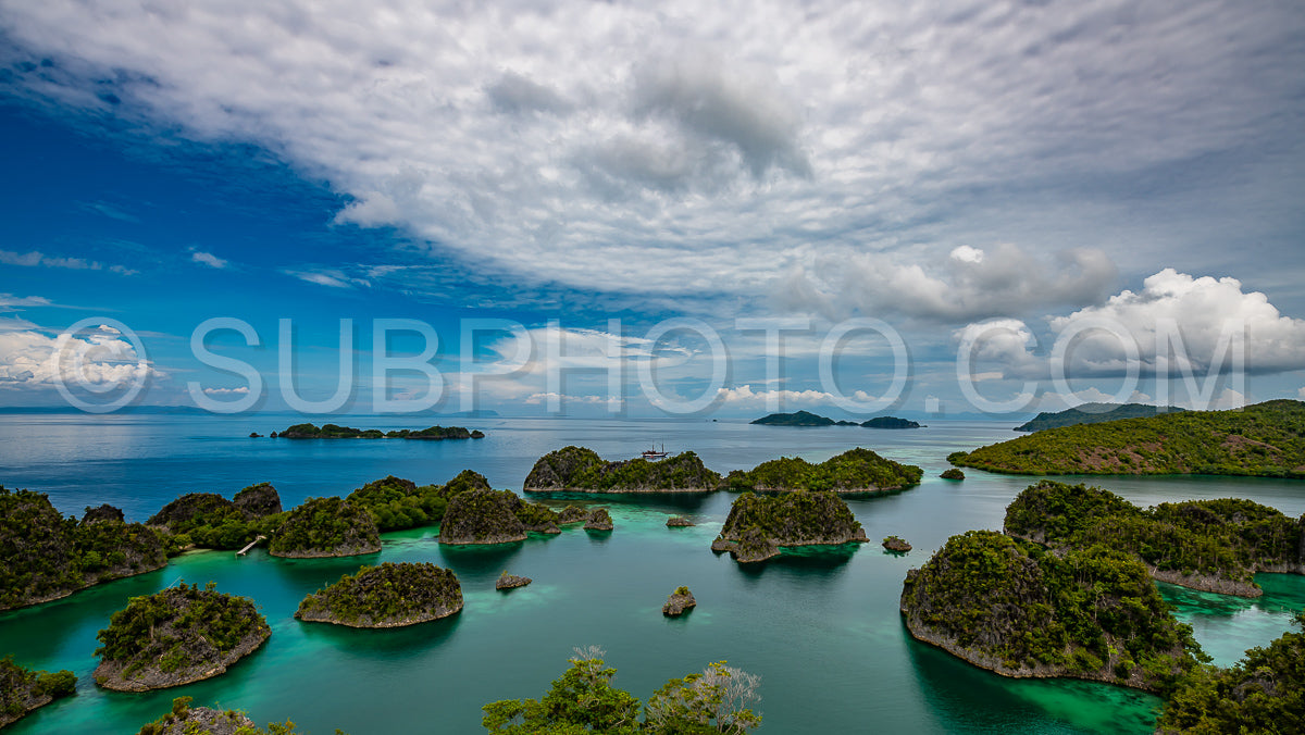 Waigeo- Kri- Mushroom Island- group of small islands in shallow blue lagoon water- Raja Ampat- West Papua- Indonesia