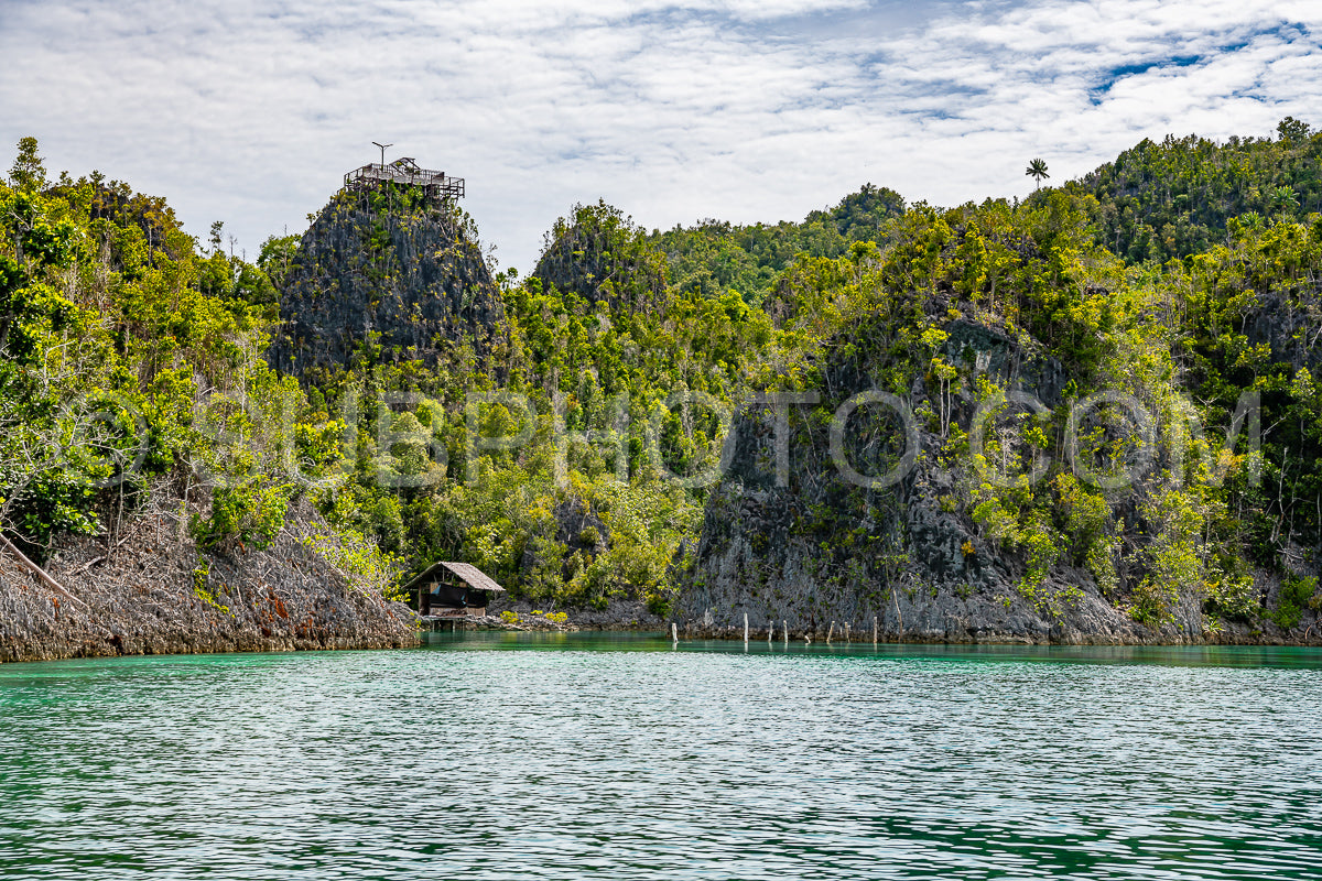 Waigeo- Kri- Mushroom Island- group of small islands in shallow blue lagoon water- Raja Ampat- West Papua- Indonesia