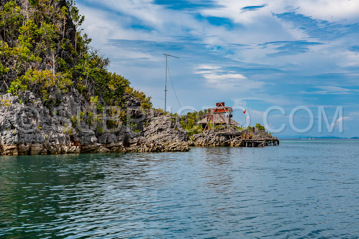 Waigeo- Kri- Mushroom Island- group of small islands in shallow blue lagoon water- Raja Ampat- West Papua- Indonesia