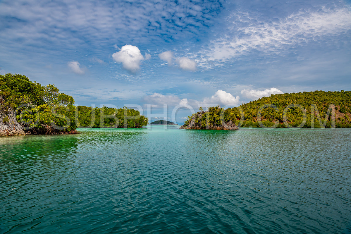 Waigeo- Kri- Mushroom Island- group of small islands in shallow blue lagoon water- Raja Ampat- West Papua- Indonesia
