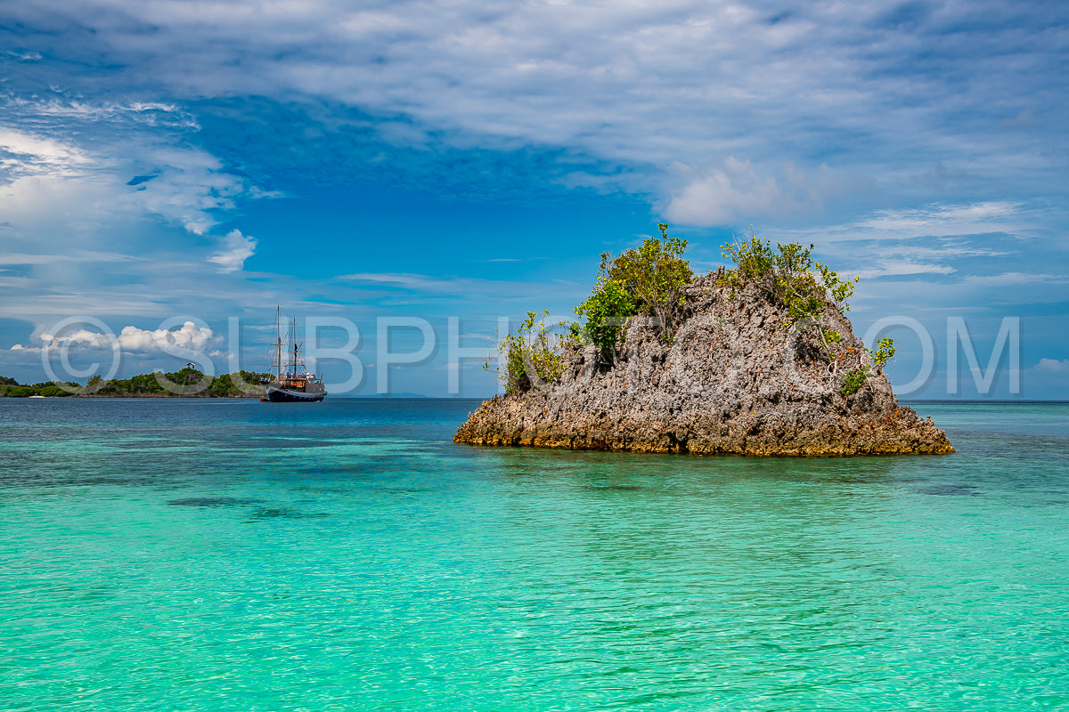 Waigeo- Kri- Mushroom Island- group of small islands in shallow blue lagoon water- Raja Ampat- West Papua- Indonesia