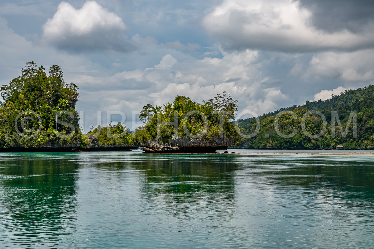Waigeo- Kri- Mushroom Island- group of small islands in shallow blue lagoon water- Raja Ampat- West Papua- Indonesia