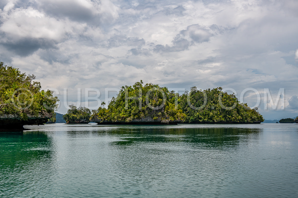 Waigeo- Kri- Mushroom Island- group of small islands in shallow blue lagoon water- Raja Ampat- West Papua- Indonesia