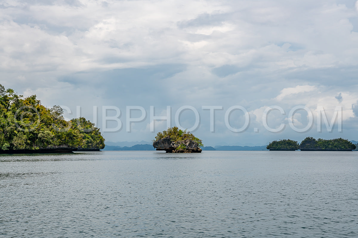 Waigeo- Kri- Mushroom Island- group of small islands in shallow blue lagoon water- Raja Ampat- West Papua- Indonesia