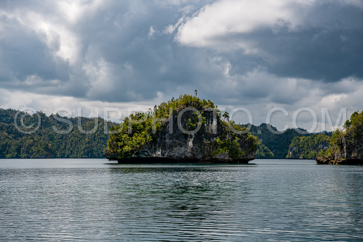 Waigeo- Kri- Mushroom Island- group of small islands in shallow blue lagoon water- Raja Ampat- West Papua- Indonesia