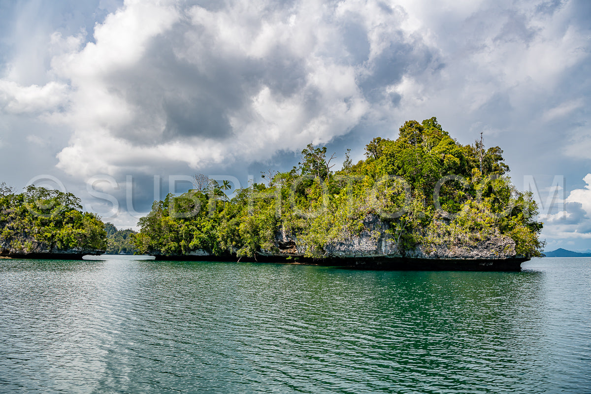 Waigeo- Kri- Mushroom Island- group of small islands in shallow blue lagoon water- Raja Ampat- West Papua- Indonesia