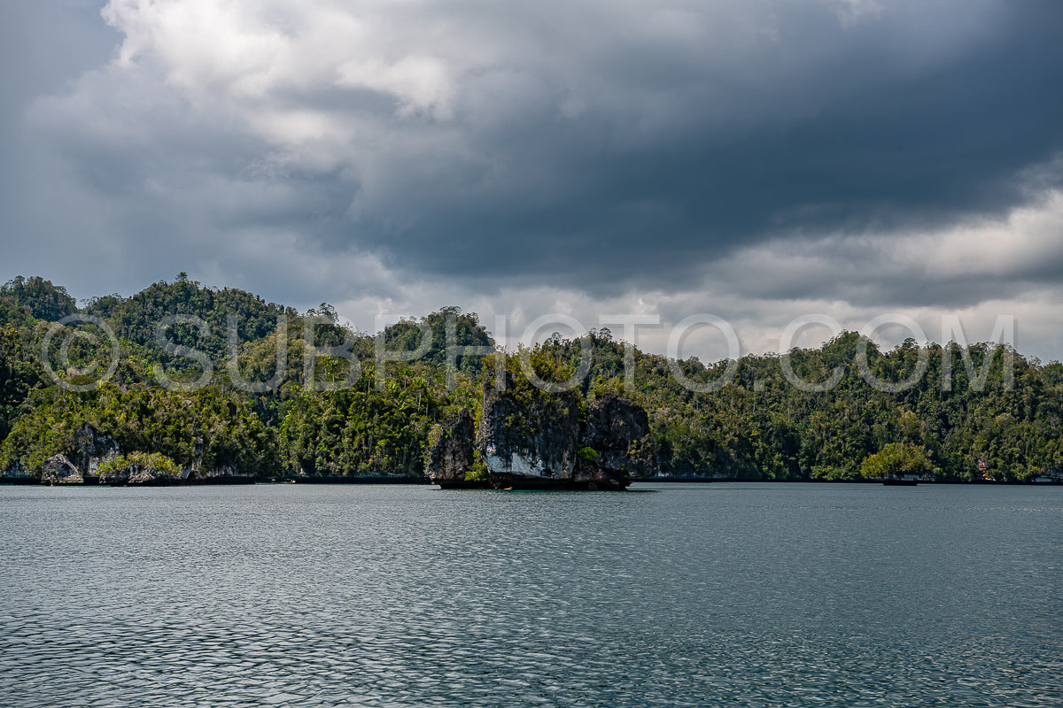 Waigeo- Kri- Mushroom Island- group of small islands in shallow blue lagoon water- Raja Ampat- West Papua- Indonesia