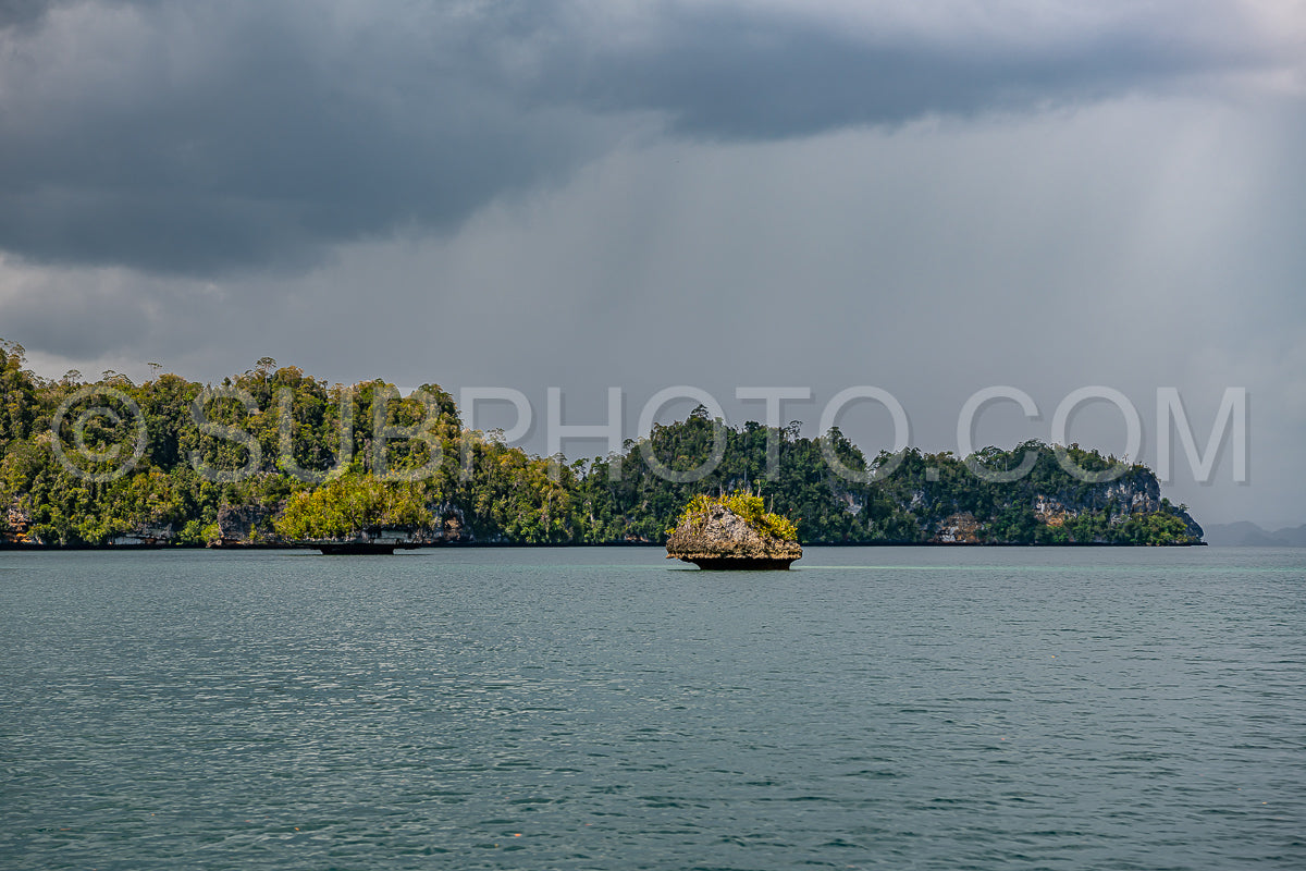 Waigeo- Kri- Mushroom Island- group of small islands in shallow blue lagoon water- Raja Ampat- West Papua- Indonesia