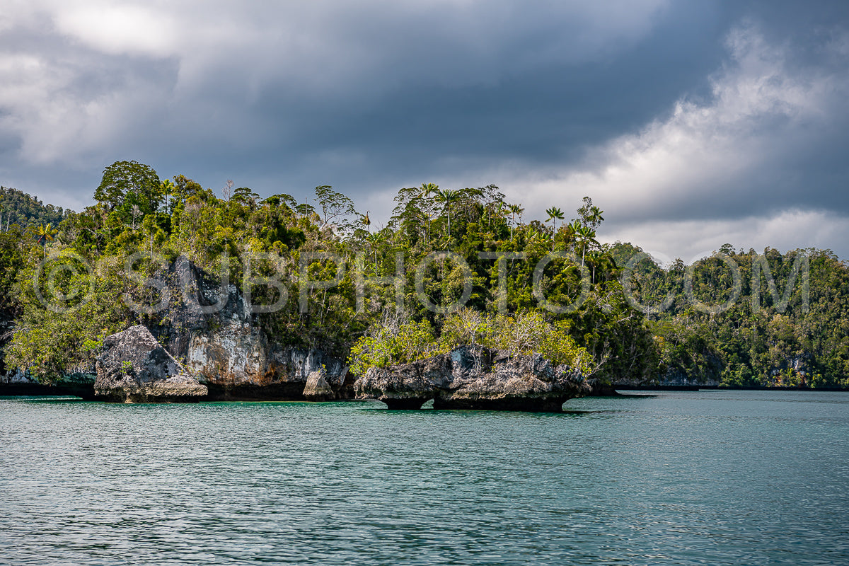 Waigeo- Kri- Mushroom Island- group of small islands in shallow blue lagoon water- Raja Ampat- West Papua- Indonesia