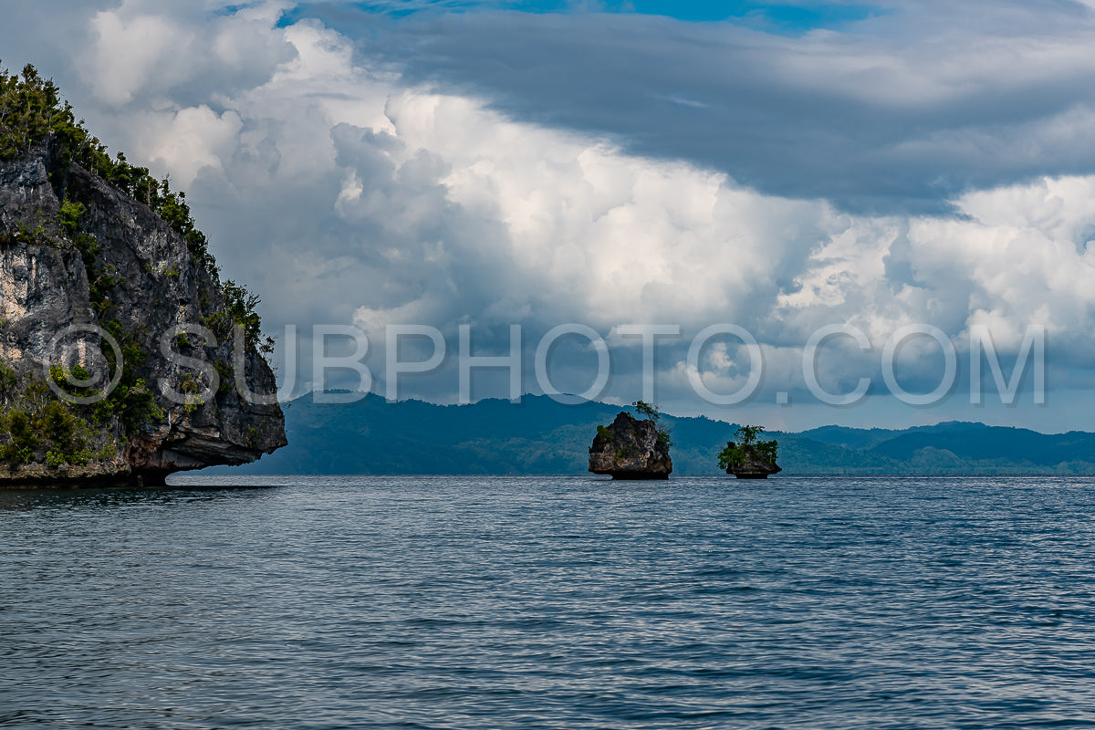 Waigeo- Kri- Mushroom Island- group of small islands in shallow blue lagoon water- Raja Ampat- West Papua- Indonesia