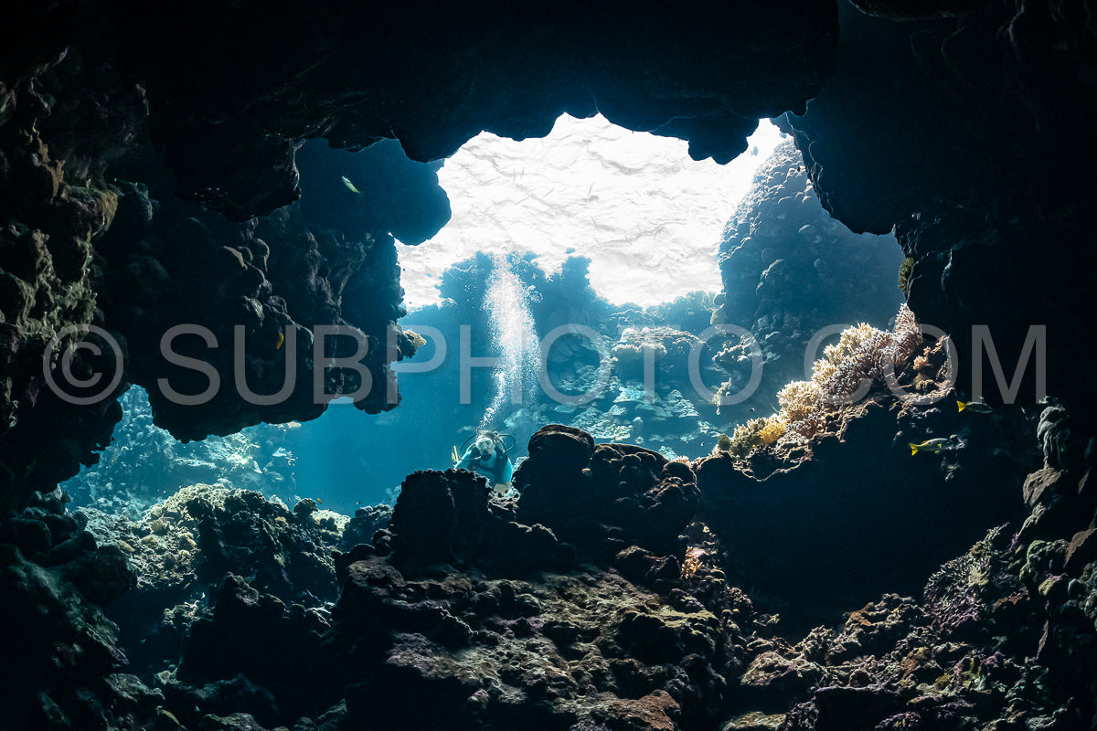 woman diver visiting underwater cave in the Red Sea- egypt- Shaab Claude