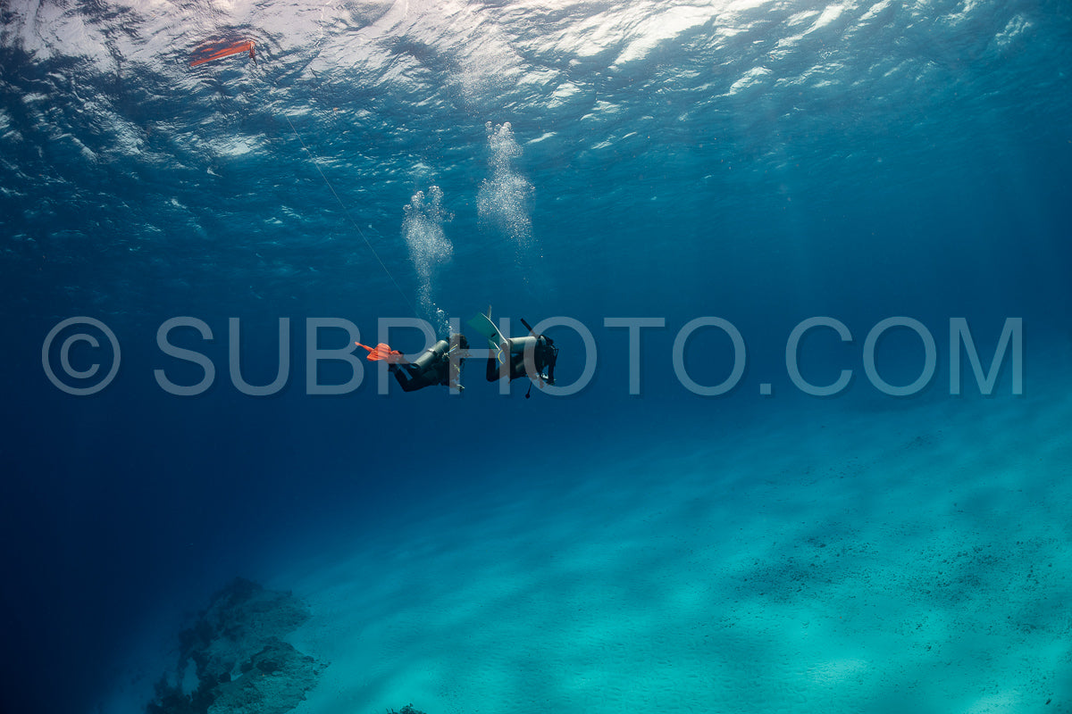 woman scuba diving on Cozumel coral reef in Mexico