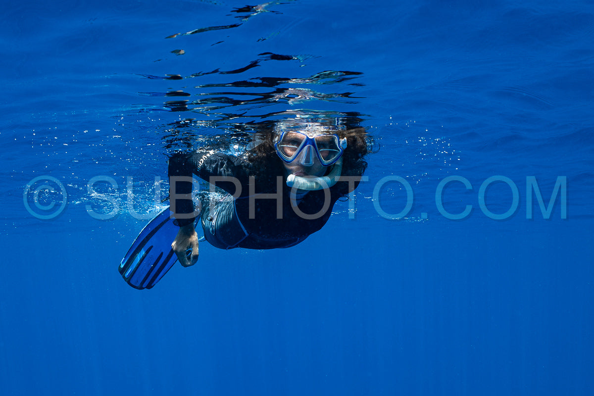 woman snorkeling in polynesian deep waters