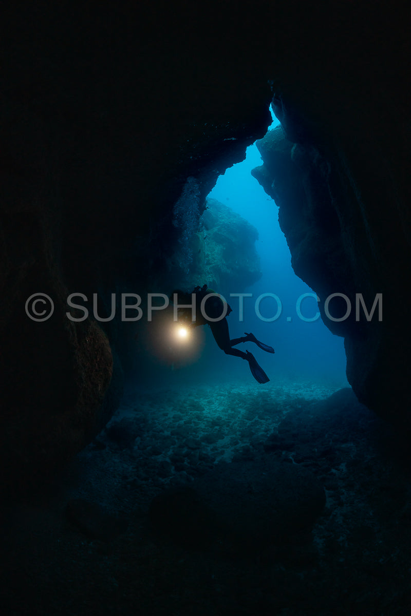 woman diver visiting a cave