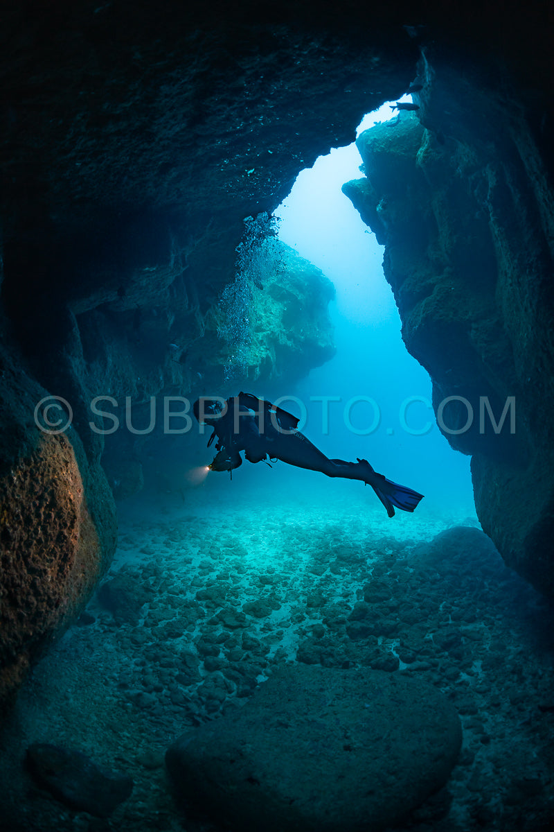 woman diver visiting a cave