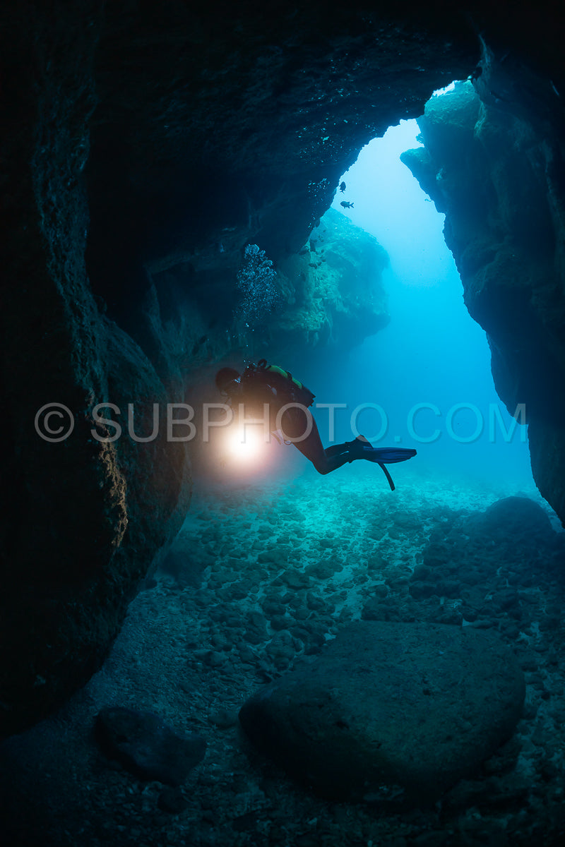 woman diver visiting a cave