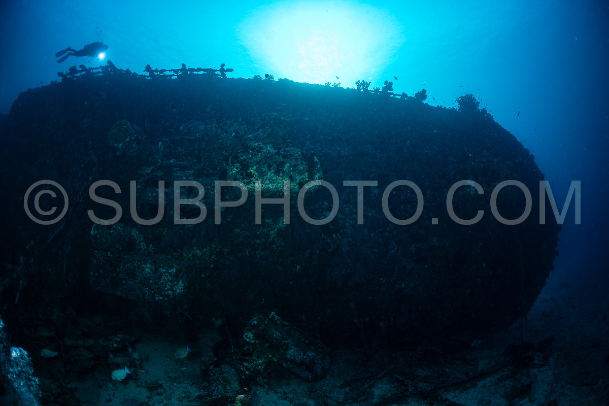 diver over a ship wreck in the Maldives