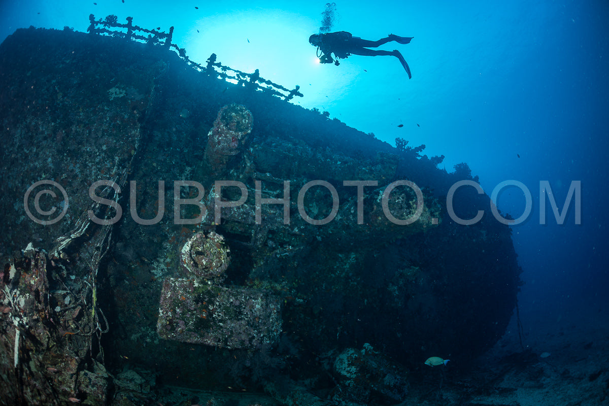 diver over a ship wreck in the Maldives