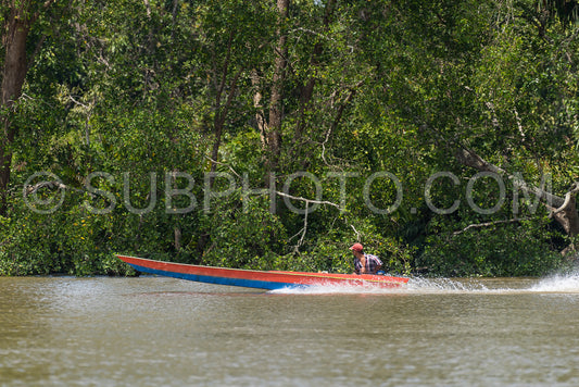Wooden boat cruising Berau river- Borneo- Kalimantnan- Indonesia