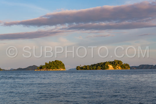 East Misool- group of small island in shallow blue lagoon water at sunset- Raja Ampat- West Papua- Indonesia
