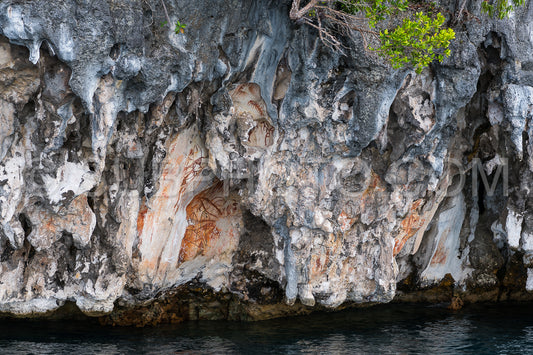 Prehistoric petroglyph rock paintings in Misool- Raja Ampat- West Papua- Indonesia by aborigines- 3-000 to 5-000 years ago