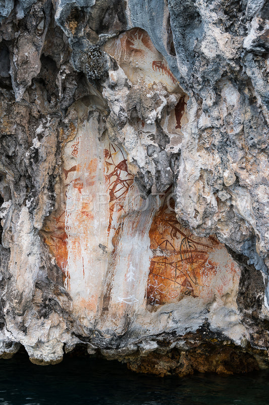 Prehistoric petroglyph rock paintings in Misool- Raja Ampat- West Papua- Indonesia by aborigines- 3-000 to 5-000 years ago