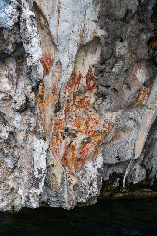 Prehistoric petroglyph rock paintings in Misool- Raja Ampat- West Papua- Indonesia by aborigines- 3-000 to 5-000 years ago