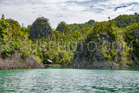 Waigeo- Kri- Mushroom Island- group of small islands in shallow blue lagoon water- Raja Ampat- West Papua- Indonesia