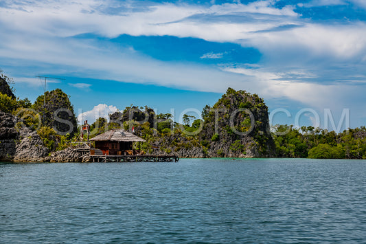 Waigeo- Kri- Mushroom Island- group of small islands in shallow blue lagoon water- Raja Ampat- West Papua- Indonesia