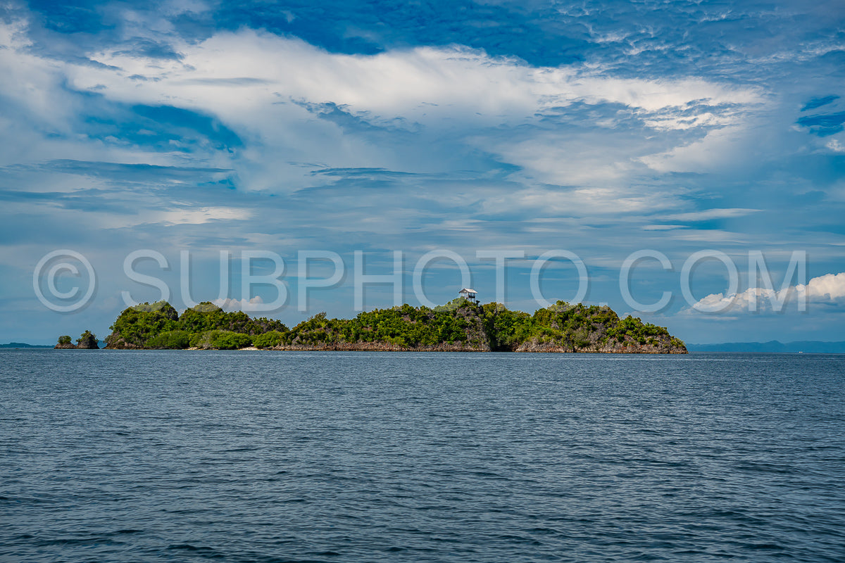 Waigeo- Kri- Mushroom Island- group of small islands in shallow blue lagoon water- Raja Ampat- West Papua- Indonesia