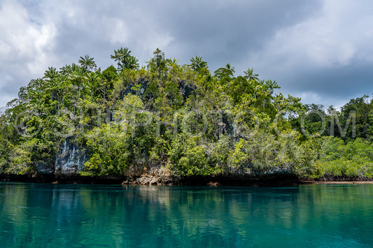 Waigeo- Kri- Mushroom Island- group of small islands in shallow blue lagoon water- Raja Ampat- West Papua- Indonesia