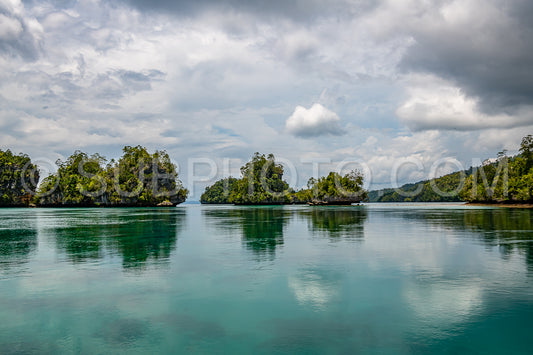 Waigeo- Kri- Mushroom Island- group of small islands in shallow blue lagoon water- Raja Ampat- West Papua- Indonesia