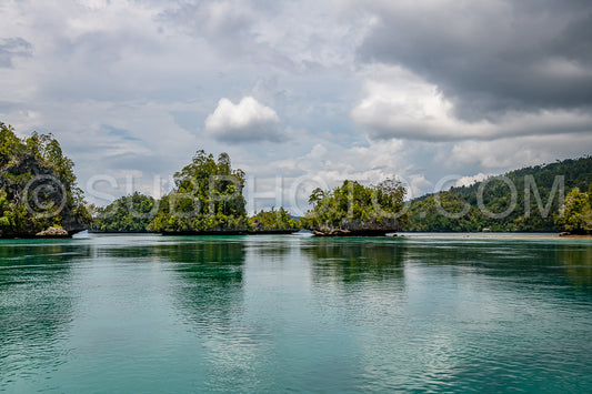 Waigeo- Kri- Mushroom Island- group of small islands in shallow blue lagoon water- Raja Ampat- West Papua- Indonesia