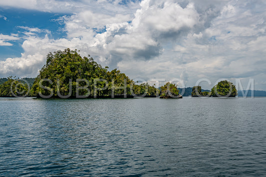 Waigeo- Kri- Mushroom Island- group of small islands in shallow blue lagoon water- Raja Ampat- West Papua- Indonesia