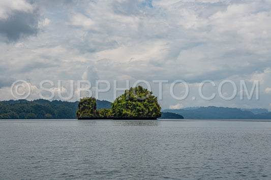 Waigeo- Kri- Mushroom Island- group of small islands in shallow blue lagoon water- Raja Ampat- West Papua- Indonesia