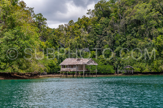 Waigeo- Kri- Mushroom Island- group of small islands in shallow blue lagoon water- Raja Ampat- West Papua- Indonesia