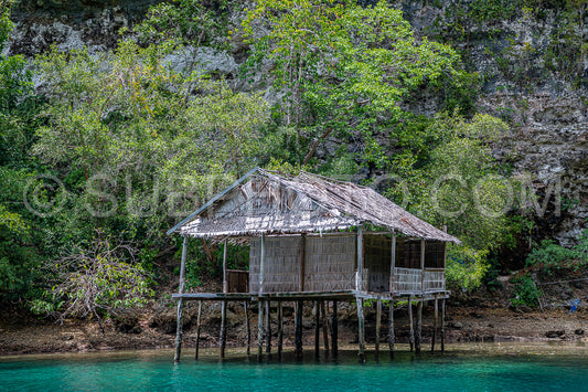 Waigeo- Kri- Mushroom Island- group of small islands in shallow blue lagoon water- Raja Ampat- West Papua- Indonesia