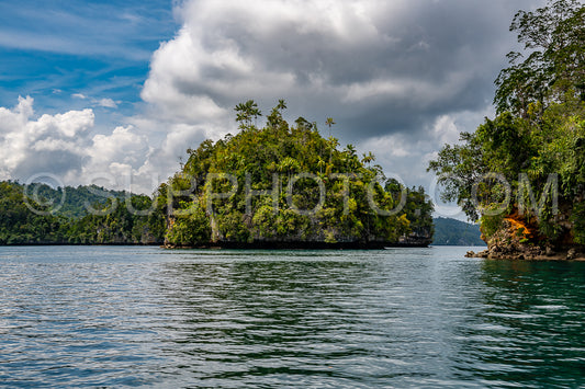 Waigeo- Kri- Mushroom Island- group of small islands in shallow blue lagoon water- Raja Ampat- West Papua- Indonesia