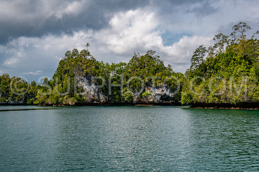 Waigeo- Kri- Mushroom Island- group of small islands in shallow blue lagoon water- Raja Ampat- West Papua- Indonesia