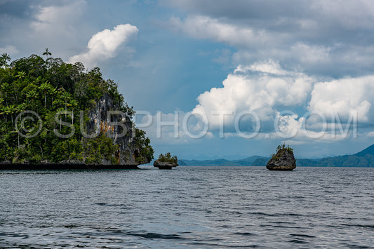 Waigeo- Kri- Mushroom Island- group of small islands in shallow blue lagoon water- Raja Ampat- West Papua- Indonesia