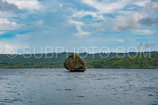 Waigeo- Kri- Mushroom Island- group of small islands in shallow blue lagoon water- Raja Ampat- West Papua- Indonesia