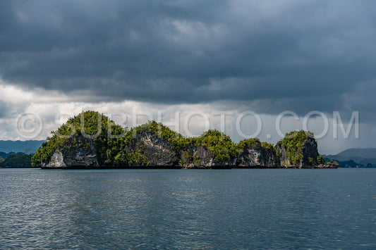 Waigeo- Kri- Mushroom Island- group of small islands in shallow blue lagoon water- Raja Ampat- West Papua- Indonesia