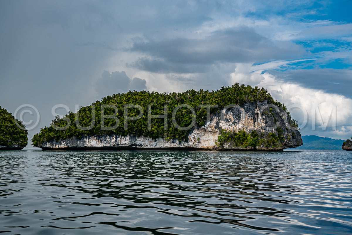 Waigeo- Kri- Mushroom Island- group of small islands in shallow blue lagoon water- Raja Ampat- West Papua- Indonesia