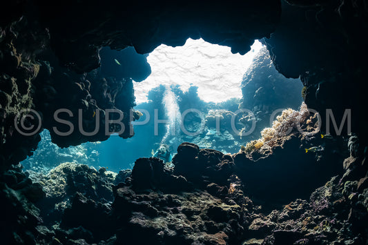 woman diver visiting underwater cave in the Red Sea- egypt- Shaab Claude