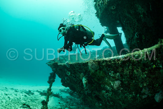 woman scuba diving on Cozumel coral reef in Mexico